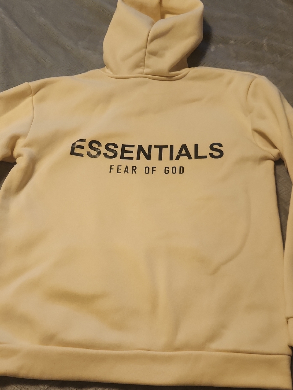 Fear of God Essentials Hoodie in Pale Yellow Or Cream with Black Logo